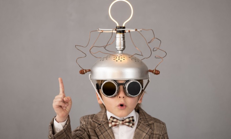 Kid with homemade helmet with light bulb